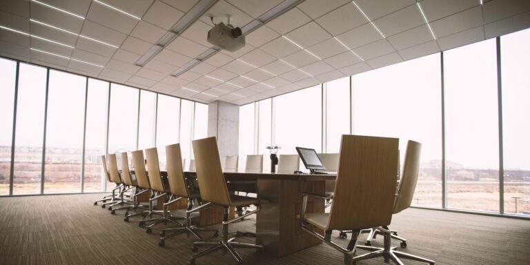 An edited photo showcasing grid lighting in a drop ceiling