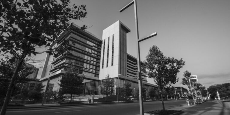 Photo of streetlamps lining a downtown road